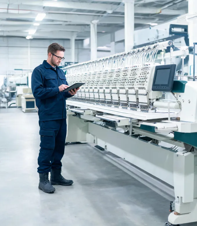 Service specialist documenting a machine inspection