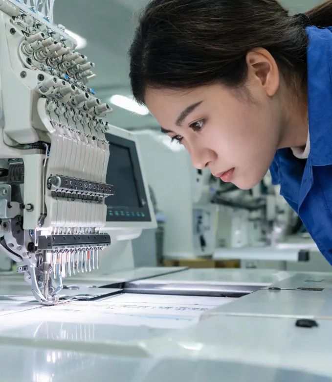 Operator checking thread path and needle area
